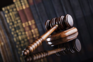 employee benefit lawyer Columbus, OH with a gavel on a table in front of old books